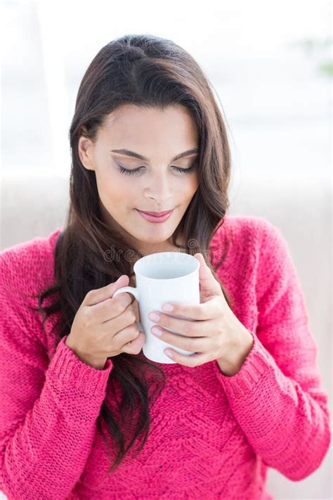 Smiling Beautiful Brunette Relaxing On The Couch And Holding Mug Stock Image Image Of Couch