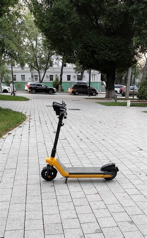 Electric Yellow Scooter on a City Street Stock Image - Image of city, dessert: 224491351