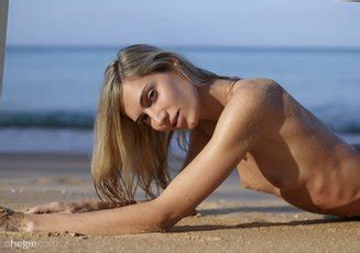 Hot Francy Torino Practices Nude Yoga On The Beach Photos