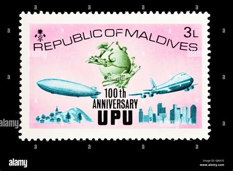 Postage Stamp From The Maldives Depicting A Zeppelin And Modern Jet