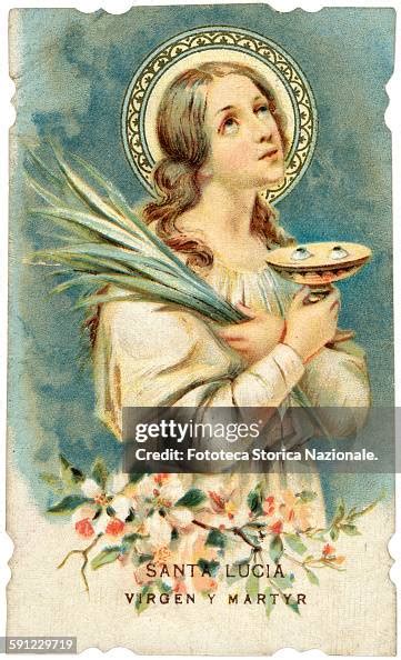 the Saint is depicted with the palm of martyrdom and the cup with