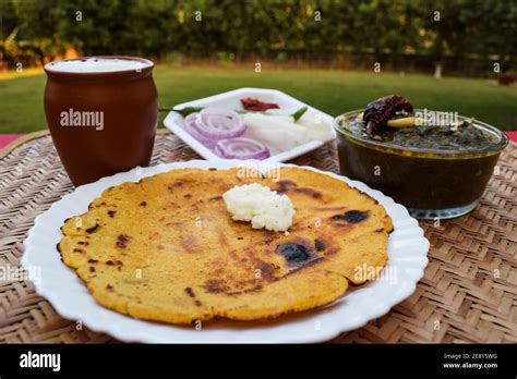 Side View Of Makki Di Roti And Sarson Da Saag Mustard Leaves Curry And