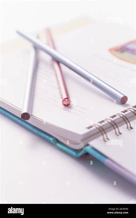 Pencil and book Stock Photo - Alamy