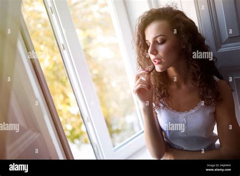 Beautiful Brunette Eating Cookies With Passion Stock Photo Alamy
