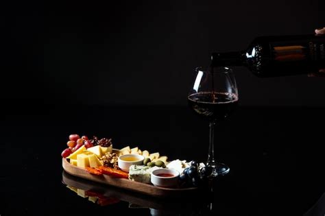 Premium Photo | Cheese platter with snacks for wine