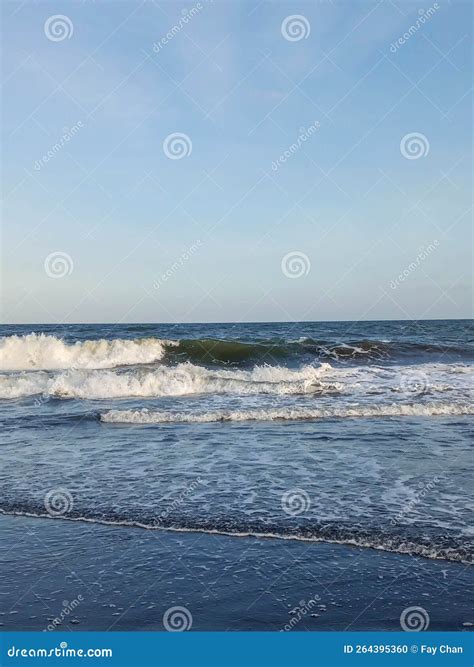 Waves on the beach stock photo. Image of black, blue - 264395360