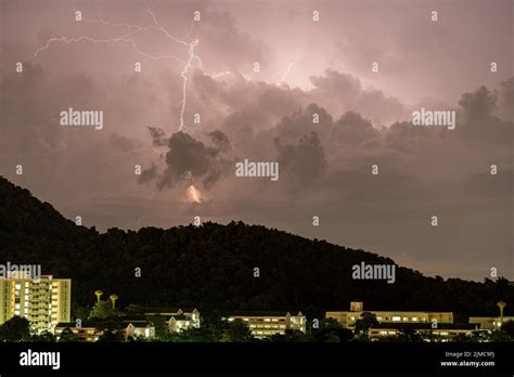 Storm Lightning Strikes In Mountains During A Thunderstorm At Night