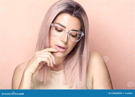 Beautiful Woman Wearing Trendy Nude Glasses Or Eyewear Looking Down Pensive Stock Photo Image