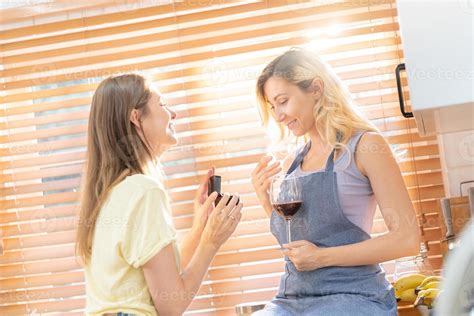Lesbian Proposing Her Girlfriend With A Engagement Ring Happy Engaged Lesbian Couple