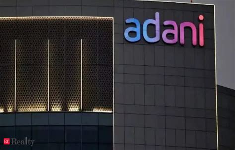 Adani Group Ambuja Cements Stocks Dip Acc Tanks After