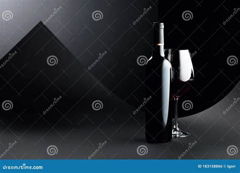 Bottle And Glass Of Red Wine On A Dark Background Stock Photo Image