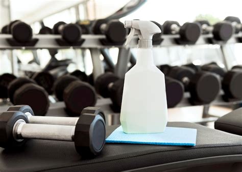 Free Photo Side View Of Woman Cleaning Gym Equipment