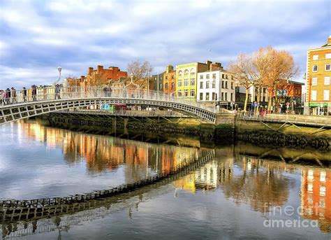 Dublin Ha'penny Bridge Reflection Photograph by John Rizzuto