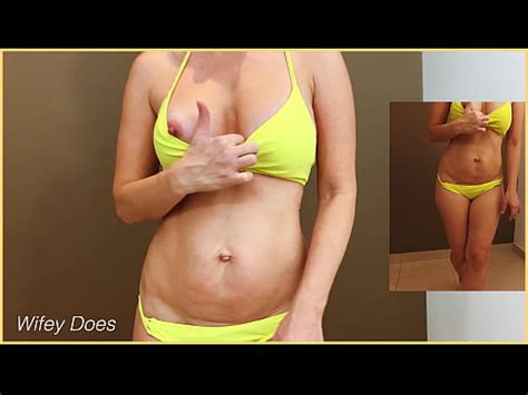 MILF Flashes Her Tits And Hot Ass Trying On A Yellow Bikini XNXX