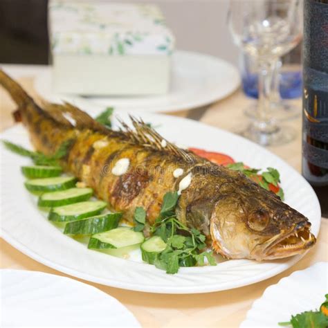 Large Fried Fish On A Platter With Vegetables Stock Photo Image Of