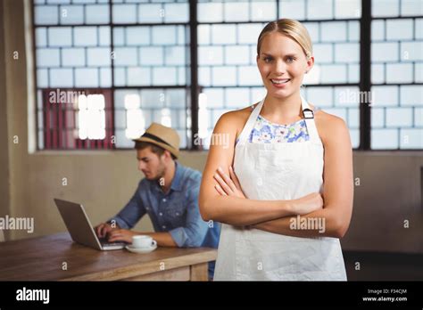 Smiling Blonde Waitress Posing In Front Of Customer Stock Photo Alamy