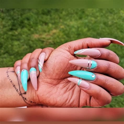 Nude And A Touch Of Turquoise Stiletto Nails