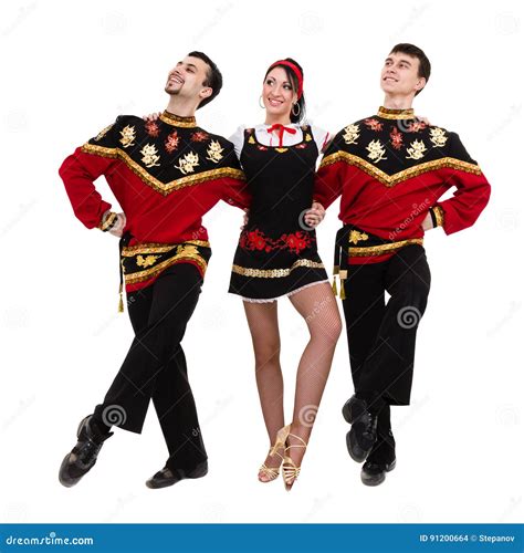 Two Men and One Woman Wearing a Folk Russian Costume Posing Stock Photo