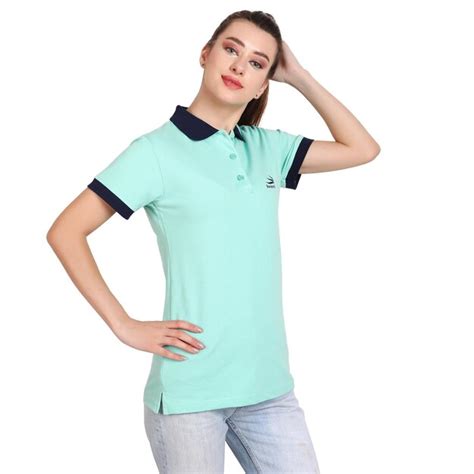 Premium Photo A Woman Wearing A Green Shirt With A Logo On The Front