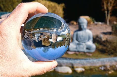 Premium Photo Close Up Of Person Holding Crystal Ball