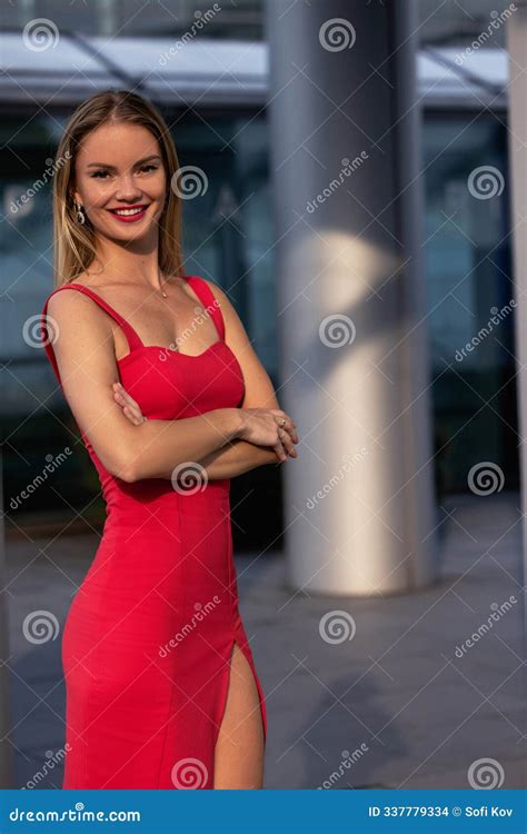 Beautiful Blonde Girl In Red Dress With Perfect Legs In Pantyhose And Shoes With High Heels