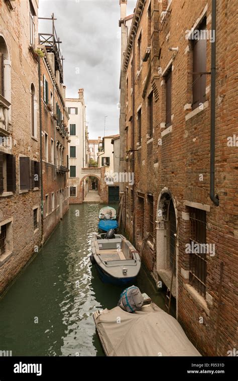 Venice canals with boats in spring Stock Photo - Alamy