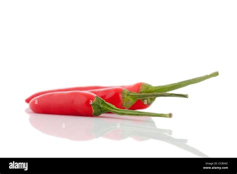 Three Red Hot Chili Peppers Isolated Over White Background Stock Photo Alamy
