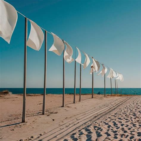 Premium AI Image | White flags on the beach