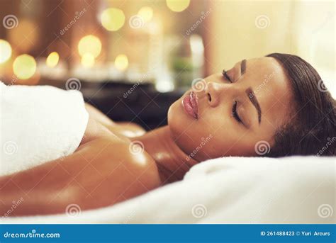 Spa Day And Stress Is Not Invited An Attractive Young Woman Relaxing On A Massage Table At A