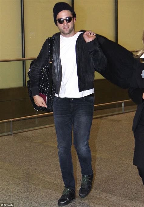 Robert Pattinson Embraces His Feminine Side As He Touches Down In