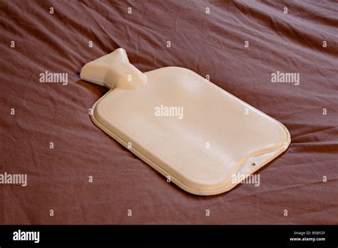 Hot Water Bottle On Bed Close Up Stock Photo Alamy