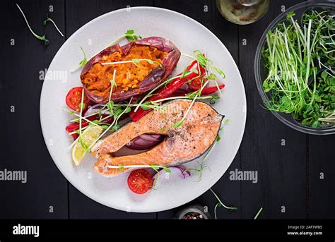 Healthy Food Baked Salmon And Sweet Potato And Vegetables Top View