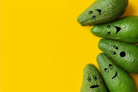 Premium Photo | Avocado emoji on yellow background copy space