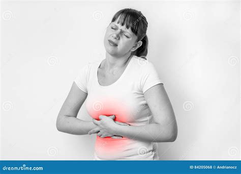 Woman With Stomach Pain Is Holding Her Aching Belly Stock Photo Image