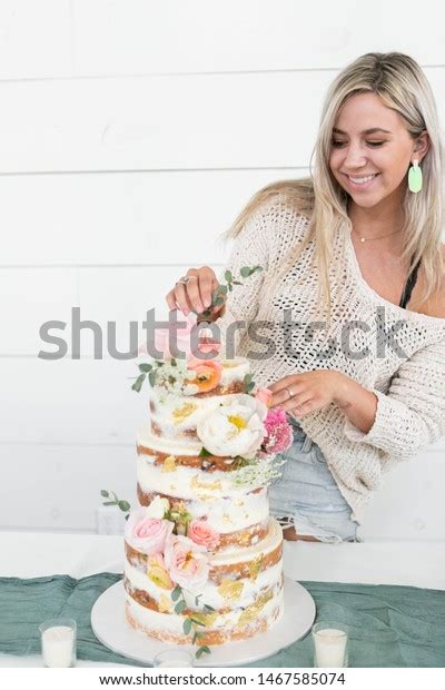 Woman Decorating Naked Wedding Cake Flowers Stock Photo