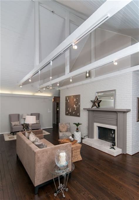 WhiteTongue And Groove Vaulted Ceiling With Exposed Beams This Track