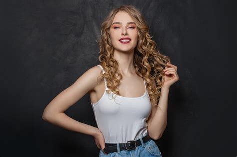 Premium Photo Smiling Blonde Woman On Black Portrait