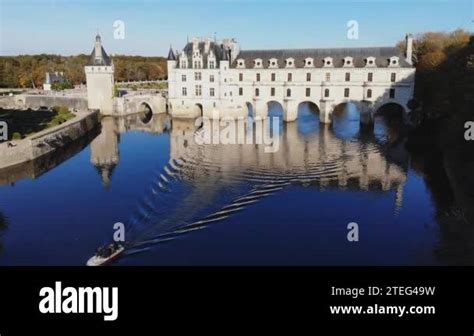 Aerial drone view of medieval French Castle of Chenonceau and its gardens on Cher River, France ...