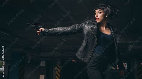 Beautiful Brunette Sexy Spy Agent Killer Or Police Woman In Leather Jacket And Jeans With A