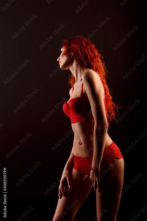 Sexy Woman In Lingerie In Black Background Red Hair Stock Photo Adobe Stock