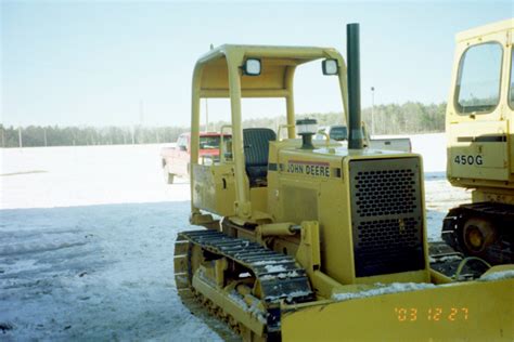 John Deere 450G Bulldozer in Snow