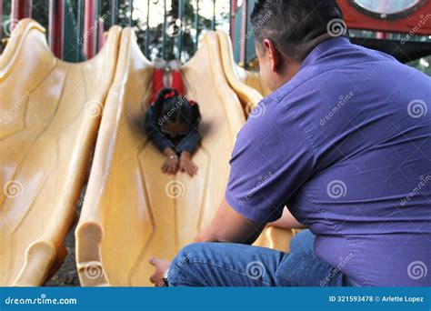 Dad Takes Care Of His Year Old Brunette Latina Daughter In The Park Games So She Doesn T Get