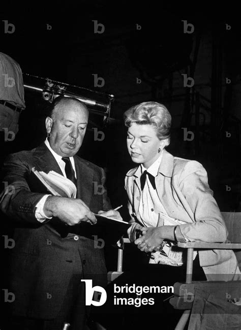 Image of Doris Day and Alfred Hitchcock on set of film The