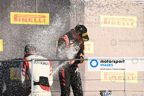 Nikita Mazepin RUS HITECH GRAND PRIX Sprays Champagne On The Podium