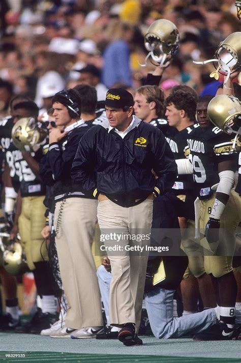 Bill McCartney of the Colorado Buffaloes walks on the sidelines... News ...