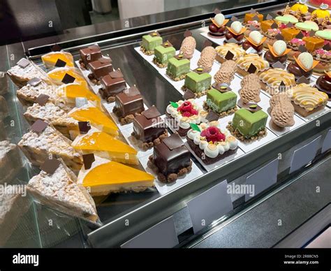 Showcase with different tasty desserts in store Stock Photo - Alamy