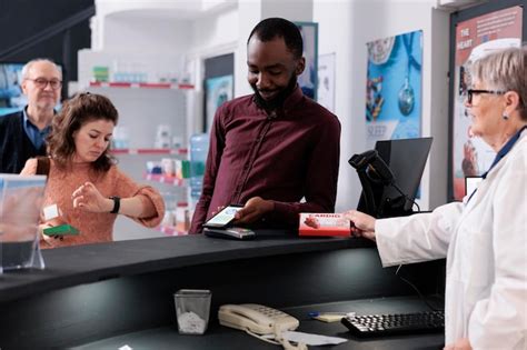 Premium Photo African American Customer Putting Phone On Pos Terminal