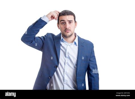 Clueless And Pensive Businessman Scratching His Head Thinking Of New