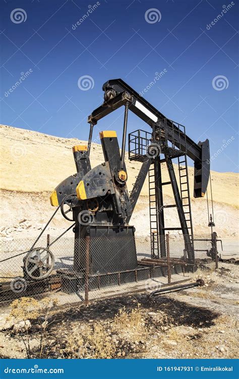 Oil Drilling Derricks At Desert Oilfield Stock Image Image Of