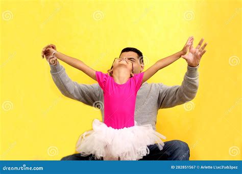 Dad Plays With His Year Old Brunette Latina Daughter Dressed As A Ballerina In A Tutu